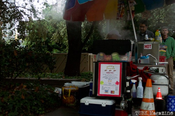 A corner hot dog vender is just one of a number of street food choices on the sidewalk along 5th Street. Photo M.Hershenow. 2014.