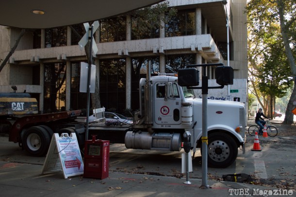 A bicyclist looks back at construction on the L Street sewer lines. Photo M.Hershenow. 2014.