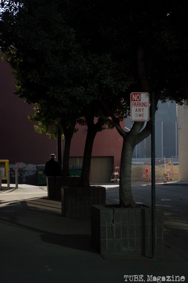 A man takes a smoke break in an alley with access to the former Downtown Plaza, site of the future Sacramento Kings Stadium. Photo M.Hershenow. 2014.