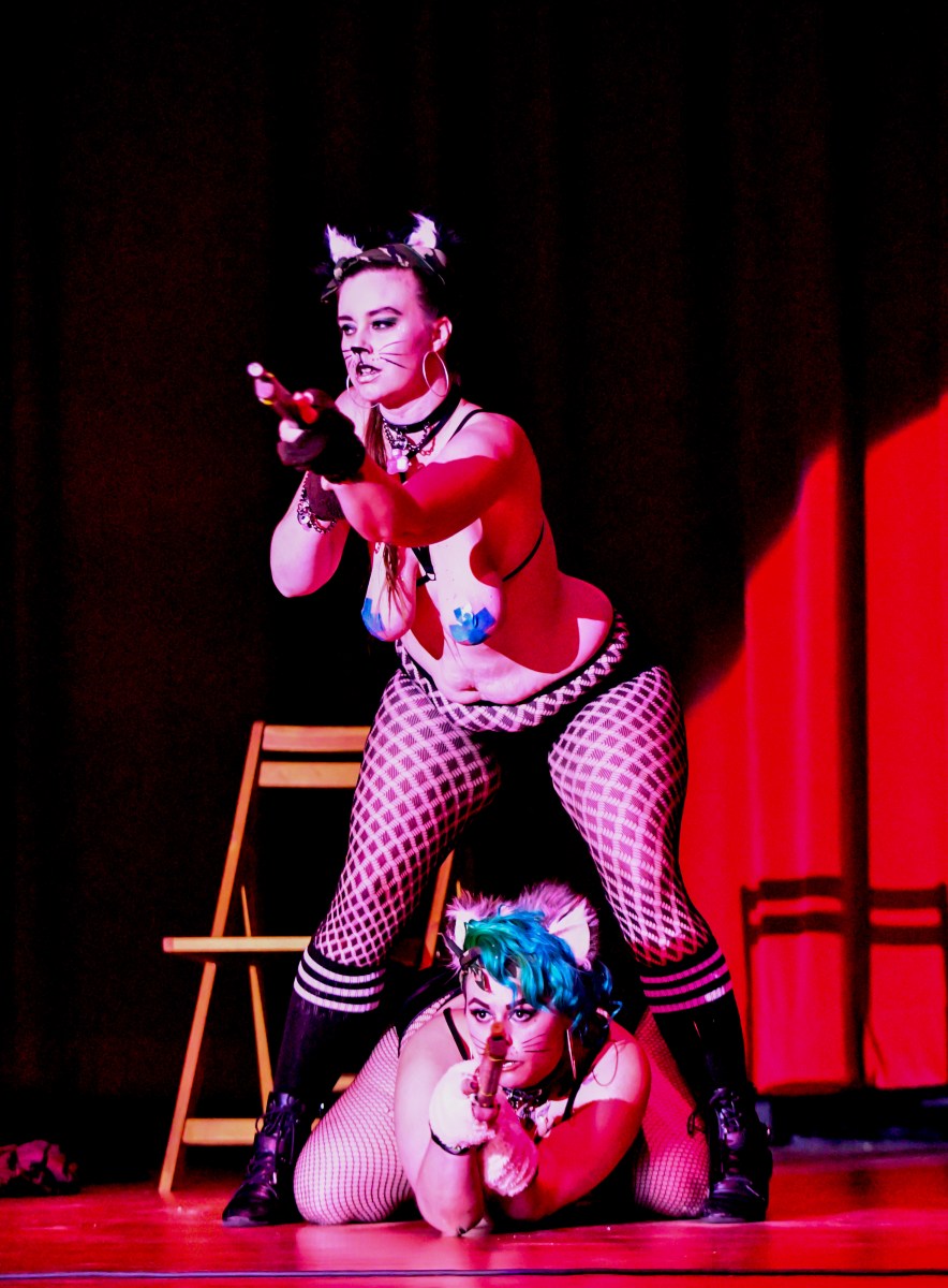 Molly Morelove and Kit performing on stage