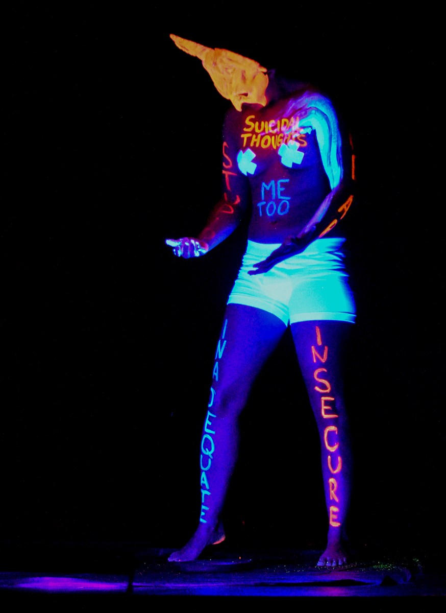 Mr. Siracha performing under black light